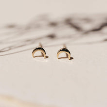Load image into Gallery viewer, off body shot of the yellow gold everyday little crescent studs
